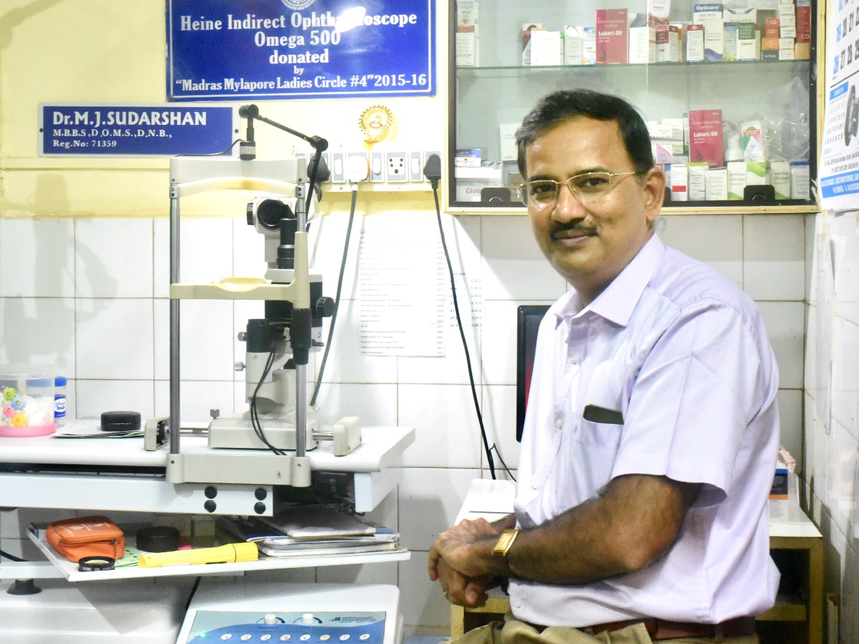 Dr. M.J. Sudarshan, Medical Director, at his consultation room with ophthalmoscope.